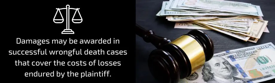 Judge’s gavel and money on table symbolizing successful claim of wrongful death case
